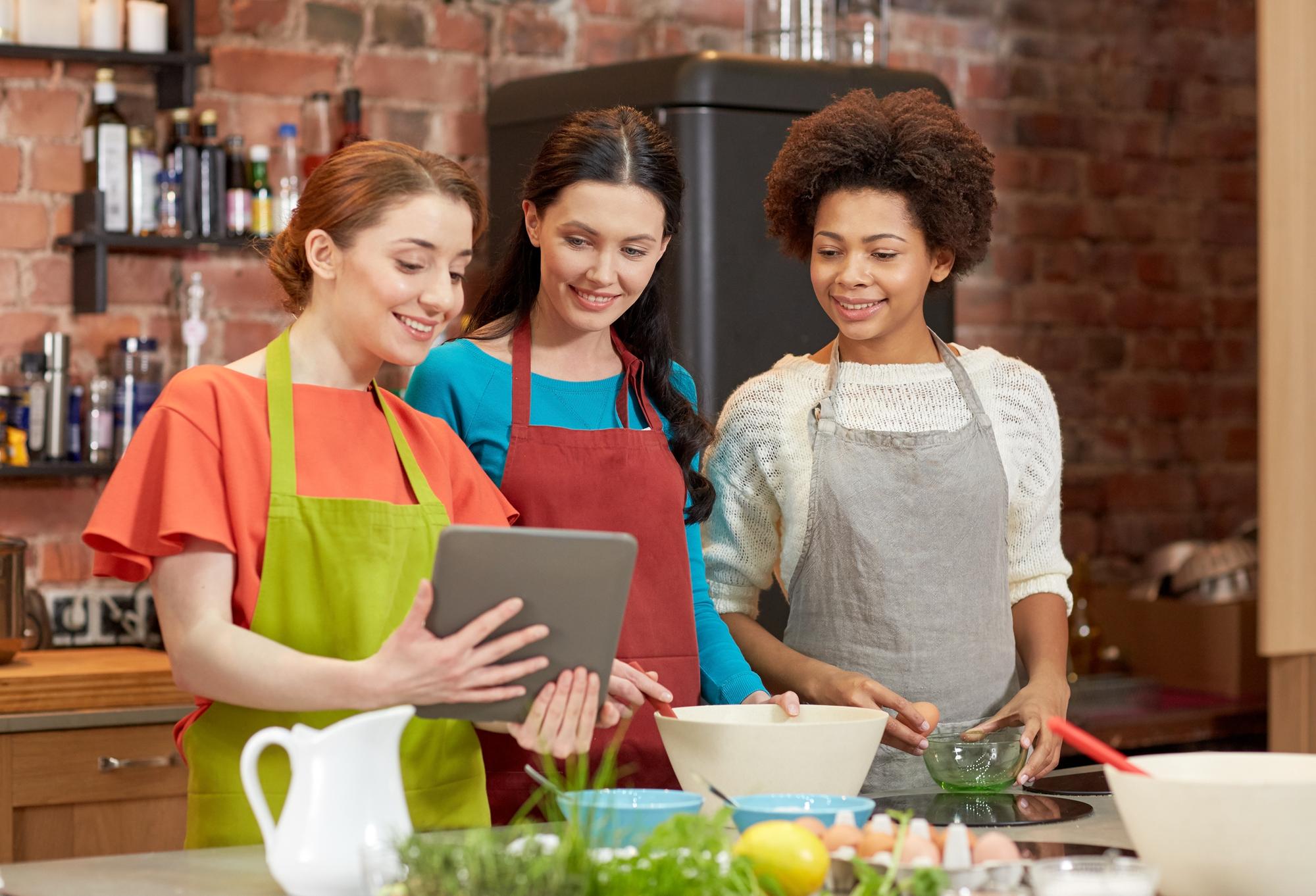 Students cooking together in small kitchen